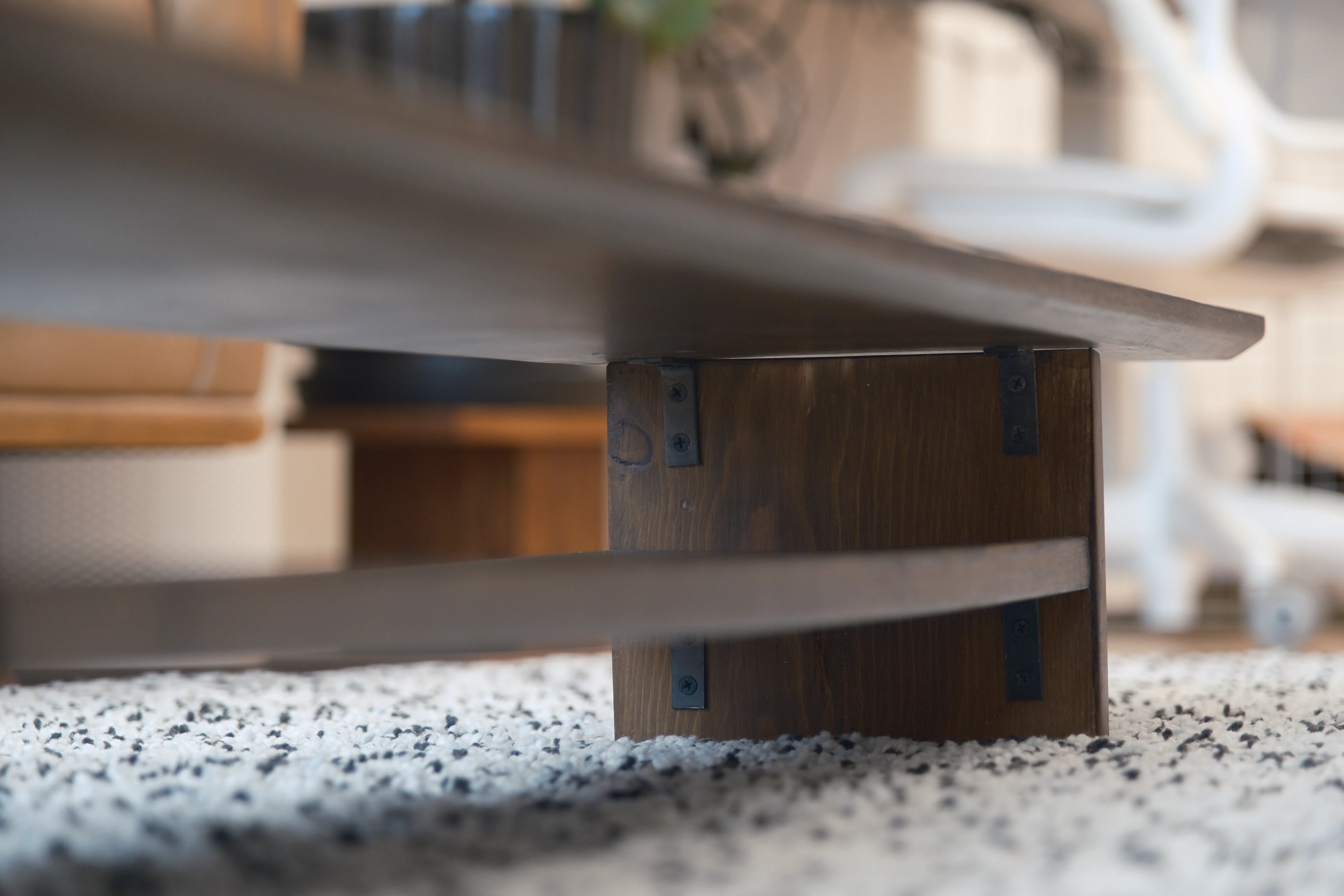 A close-up shot showing the hardware joining the pieces and the chamfer